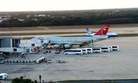 N673US @ KTPA - Northwest 744 football team charter.