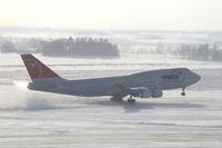 N673US @ CID - NW9980 about 2800 feet down the runway.  Wind 280@25-30 kts.  I'm glad I have my parka on! - by Glenn E. Chatfield
