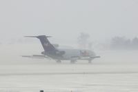 N241FE @ CID - Landing Runway 27 in the snow. wind 25-30 kts - by Glenn E. Chatfield