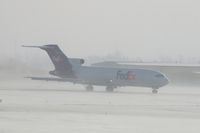 N241FE @ CID - On take-off roll Runway 27.  Blowing snow - by Glenn E. Chatfield