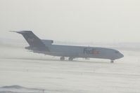 N241FE @ CID - On take-off roll Runway 27.  Blowing snow - by Glenn E. Chatfield