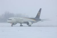 N414UP @ CID - Taxiing to cargo ramp via Alpha.  Early morning in the snow. - by Glenn E. Chatfield