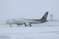 N414UP @ CID - Taxiing to cargo ramp via Alpha.  Early morning in the snow. - by Glenn E. Chatfield