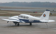 N94T @ KWWD - A 1973 Aztec sits it out on a rainy ramp at Cape May. - by Daniel L. Berek