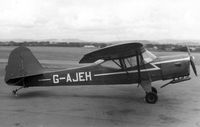 G-AJEH @ EGTE - Parked on apron in front of control tower; circa 1964 - by RockyRowe