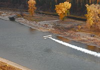 N56059 @ MSO - Flying low over Clark Fork River - by Chris Hart