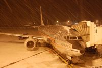 N951AA @ KBDL - The Astrojet, operating our flight AA1653 BDL-MIA, sits at gate B5 in a brief snow squall. - by Oliver Porter
