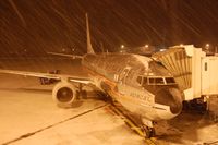 N951AA @ KBDL - The Astrojet, operating our flight AA1653 BDL-MIA, sits at gate B5 in a brief snow squall. - by Oliver Porter
