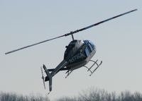 N573CA @ DTN - Not sure if this was an autorotation or not?  This Bell 206 would come in steep, stand on its tail, and then slide down the runway a little ways. Pretty neat to watch several times. - by paulp