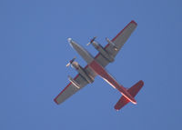 N443NA - Flying East over Columbine High School. My source tells me the 2 jet engines on the outboard pylon are used to get airborne when the temperature is high.