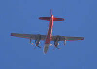 N443NA - Flying East over Columbine High School. My source tells me the 2 jet engines on the outboard pylon are used to get airborne when the temperature is high.