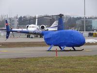 HB-ZCU @ LSZH - Robinson R44 Raven HB-ZCU Heli Sittersdorf well wrapped up waiting for it's next trip to Davos - by Alex Smit