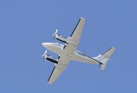 N326RT @ KSNA - Beech B200 on climbing up the blue sky. - by Mike Khansa