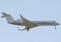 N159JA @ KSNA - Gulfstream GV-SP on short final. - by Mike Khansa