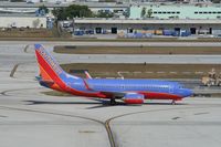 N201LV @ KFLL - Boeing 737-700 - by Mark Pasqualino
