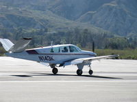 N143K @ SZP - 1964 Beech S35 BONANZA, Continental IO-520-B 285 Hp, landing roll Rwy 22 - by Doug Robertson
