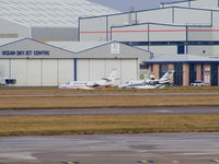 G-TBEA @ EGCC - on the Ocean Sky ramp with VP-CED - by chris hall