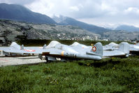 J-1154 @ LSMS - Overview of one of the Vampire storage areas at Sion. This Vampire is now preserved nearby on a pole at the local Seat garage. - by Joop de Groot