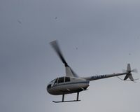 N137MT @ SAT - Robinson flying out of SAT