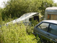 G-ARRH @ LITTLE STA - G-ARRH Cessna 175B. A sad end for this classic Cessna, dumped in the bushes at Little Staughton. Photographed in 2002 - by GeoffW