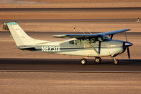 N8731X @ VGT - 1960 Cessna 182D Skylane N8731X rolling out on RWY 12R after landing. - by Dean Heald