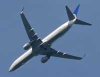 N72405 - A stretch 737 coasts in serenely over Morristown, NJ, on its way to EWR. - by Daniel L. Berek