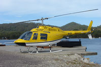 VH-CLY - Cradle Mountains Bell 206 rests on the Strahan Harbour Helipad