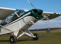 G-BWOR @ EGHP - SITTING IN THE SUN WITH AN R22 BEHIND - by BIKE PILOT