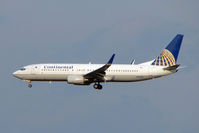 N14240 @ RJAA - Far East based Contintal B737 on approach to Narita - by Terry Fletcher