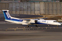 JA850A @ RJAA - ANA Dash 8 at Narita - by Terry Fletcher