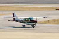 N7127G @ CID - Taxiing to landmark. - by Glenn E. Chatfield