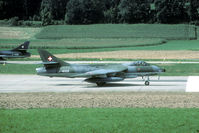 J-4102 @ LSMP - Take off run from Payerne. Seen from top of a storage hill at the south side of the airfield. - by Joop de Groot