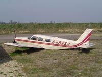 G-BAXJ @ EGSV - In a damage state following loss of undercarriage when landing short of the runway - by keith sowter