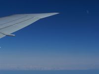 UNKNOWN - Onboard a B767 and flying near the Iceland border.  This picture doesn't seem to do it justice but just below there were a lot of iceberg's.  The outside temp. was about -43 degrees at 33000 ft. - by J.B. Barbour