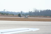 N81008 @ JNX - A hard landing can produce many factors.  Luckly for this pilot the only thing that was damaged was a blown tire.  After landing he made a quick stop in the grass and took at the damage's. - by J.B. Barbour