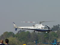 N228LA @ POC - Settling down at Pad1 next to a R22 - by Helicopterfriend