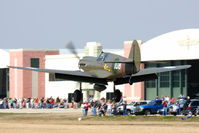 N1941P @ 42VA - 1941 Curtiss Wright P-40E Kittyhawk N1941P landing on RWY 29 after a great flight demostration, with a large crowd to witness this event. - by Dean Heald