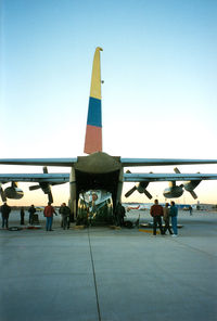 FAC1004 @ GKY - Colombian Air Force C-130 at Arlington - picking up N667GH - Huey 800 prototype