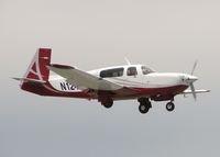 N124TN @ DTN - Landing on runway 14 at the Shreveport Downtown airport. - by paulp
