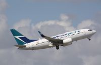 C-FKWS @ KFLL - Boeing 737-700 - by Mark Pasqualino