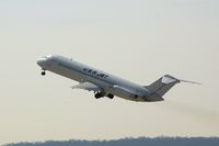 N215US @ CID - Airborne off Runway 13 - gear coming up - by Glenn E. Chatfield