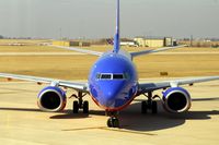 N776WN @ CID - Pulling into Landmark FBO, as seen from my office, zooming up on the cockpit - by Glenn E. Chatfield
