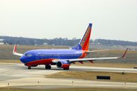 N776WN @ CID - Turning off runway 9 onto Alpha 4 - by Glenn E. Chatfield