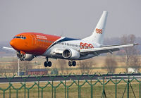 OO-TNG @ EBBR - Landing on rwy 25L. Notice contour of freighter-combi door. - by Philippe Bleus