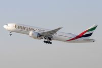A6-EWI @ KLAX - Departing LAX on 25R - by Todd Royer