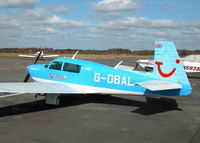G-OBAL @ EGLK - COLORFUL MOONEY PARKED ON THE TERMINAL APRON - by BIKE PILOT