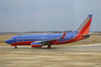 N407WN @ CID - Heading to the terminal after landing Runway 9 - by Glenn E. Chatfield