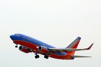 N407WN @ CID - Departing runway 9.  Almost missed this shot, having to bend over equipment to look out the window! - by Glenn E. Chatfield
