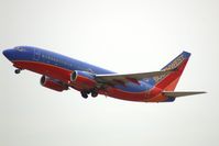 N407WN @ CID - Climbing out after departing runway 9. - by Glenn E. Chatfield