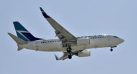 C-FWAO @ KLAX - Landing 24R at LAX - by Todd Royer